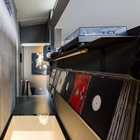 Spin some records in the DJ booth