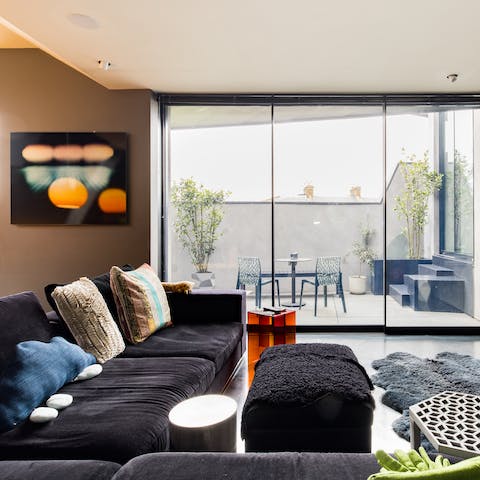 Kick back in the bright living area with a glass of wine after a busy day of sightseeing