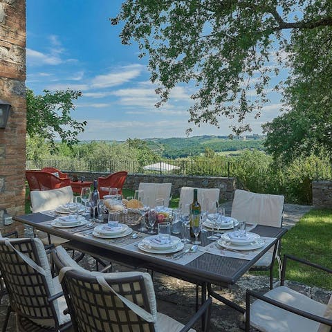 Dine alfresco with views across the Tuscan countryside