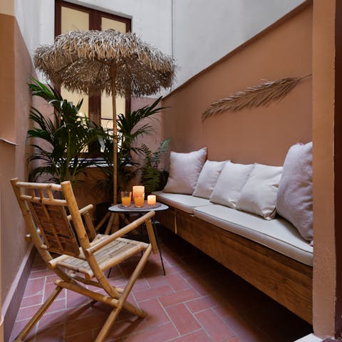 Sip cocktails in the cabana-style patio off the bedroom