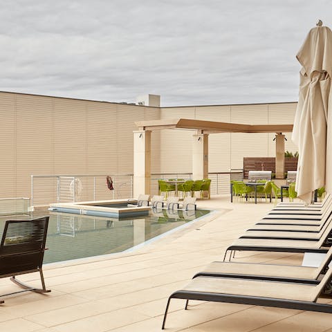 Sip cocktails on the poolside sun loungers