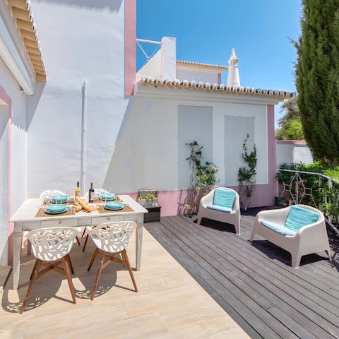 Enjoy an alfresco meal on the sun-drenched terrace