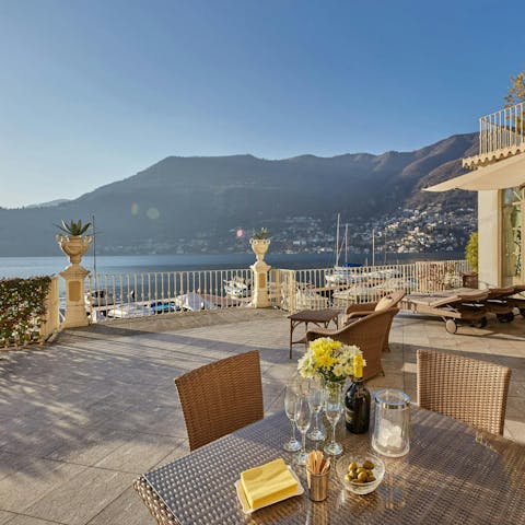 Find the perfect spot for drinks as the sun sets over the lake