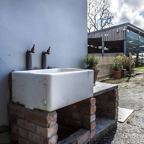 Clean up mucky pups after long walks in the countryside at the outdoor sink