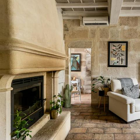 Stay warm by the charming fireplace