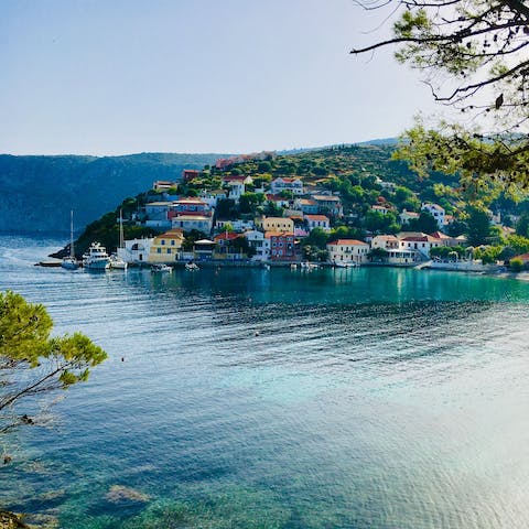 Stroll around Assos harbour, with a visit to the beach a must