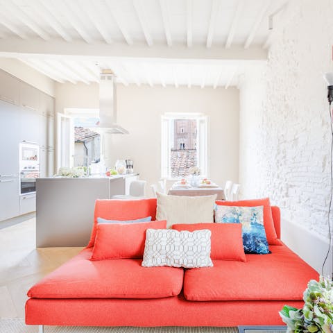 Enjoy a glass of Tuscan wine in the bright living space