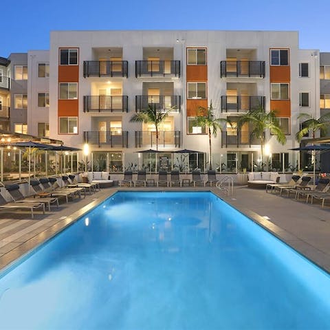 Dive into the inviting waters of the building's pool