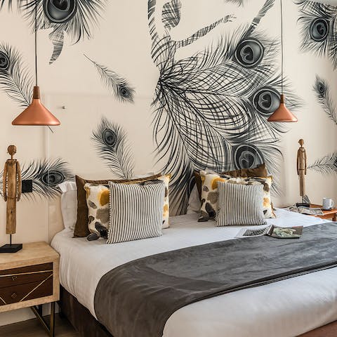Nod off in the peacock-inspired master bedroom