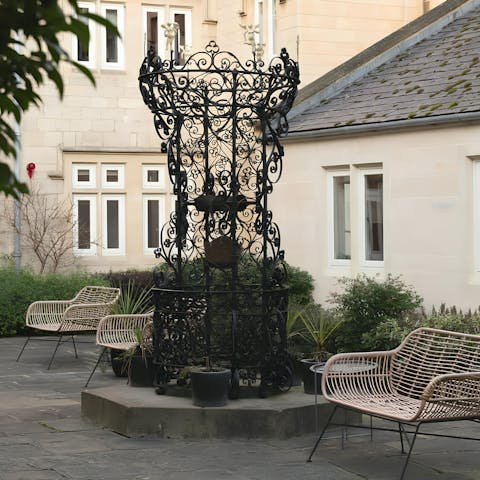 Sip a morning coffee or evening aperitif in the shared courtyard garden