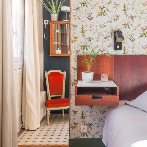 The vintage floral wallpaper in the bedroom