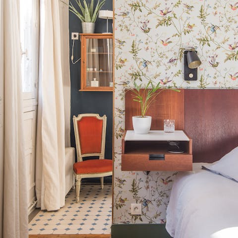The vintage floral wallpaper in the bedroom