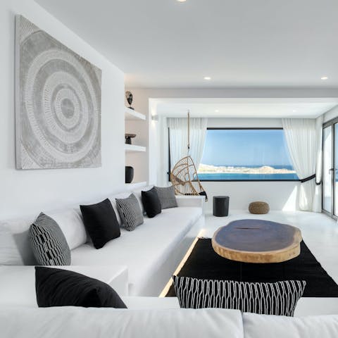 Curl up together on the L-shaped sofa in the cool living space