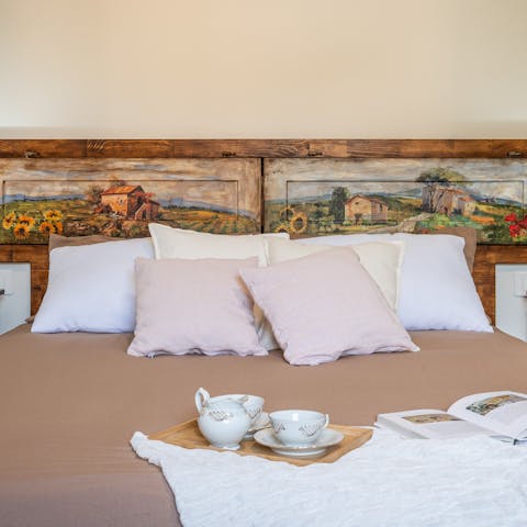 Climb into the cosy bed after a busy day exploring Tuscany