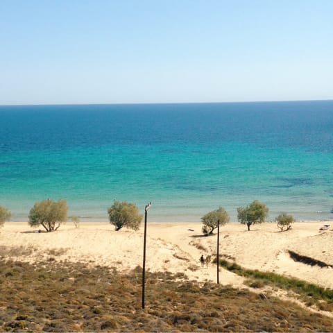 Take a fifteen-minute walk down to Paralia Melissi to paddle in the water