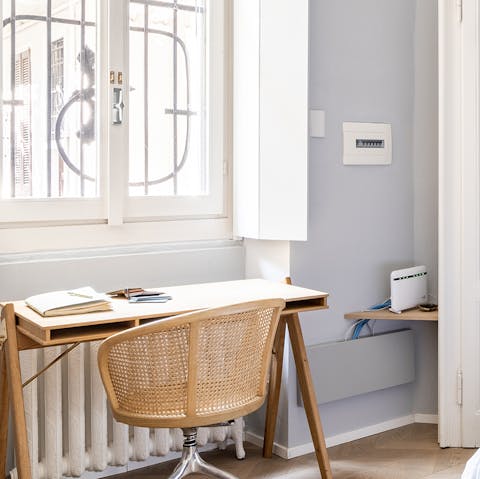 Catch up on work at the bedroom's window-facing desk