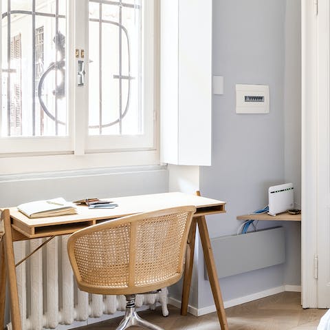 Catch up on work at the bedroom's window-facing desk