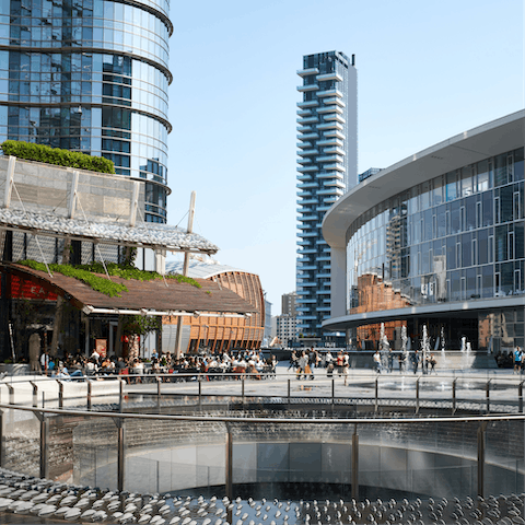 Explore the skyscrapers and shops around Piazza Gae Aulenti, a ten-minute walk away