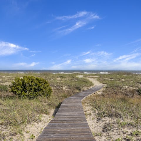 Stroll along the semi-private boardwalk straight to the beach