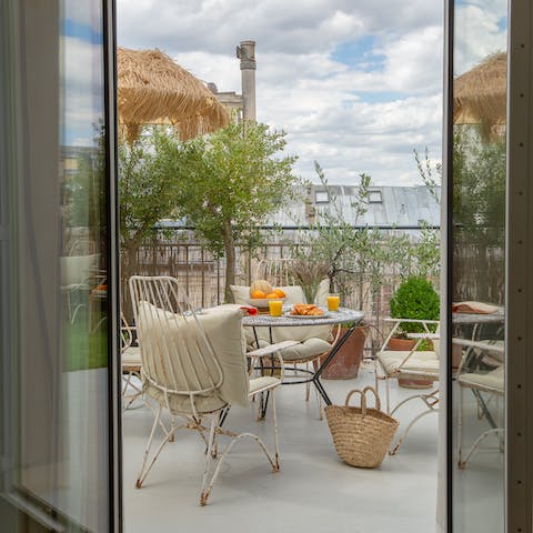 Dine out on the leafy terrace populated by olive trees