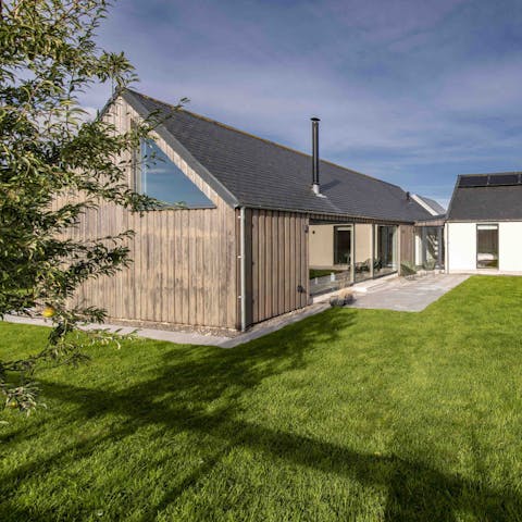 Spend a sunny evening in the garden, watching the pups run free