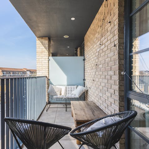 Raise a toast to your holiday on the private balcony
