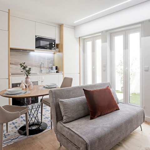 Relax in the bright living room with a glass of Portuguese wine