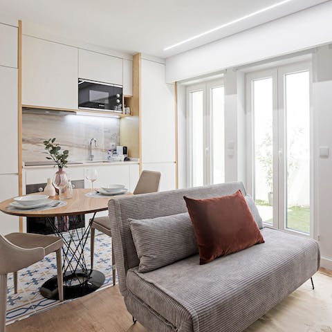 Relax in the bright living room with a glass of Portuguese wine