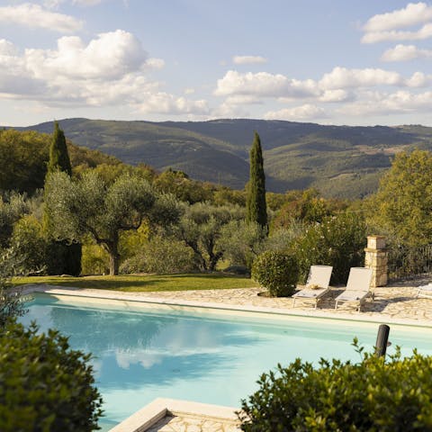 Admire the countryside views from the private pool