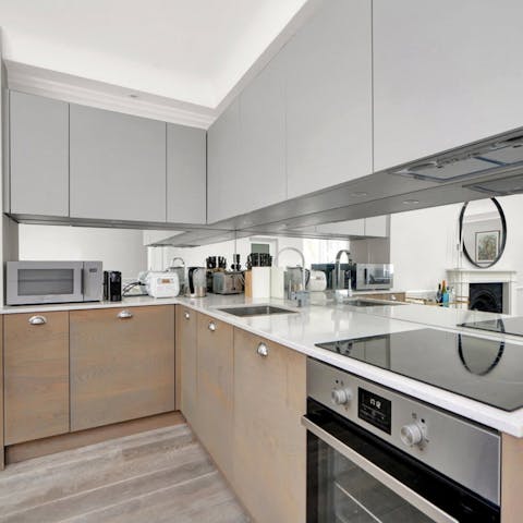 Rustle up a delicious home-cooked meal in the sleek kitchen