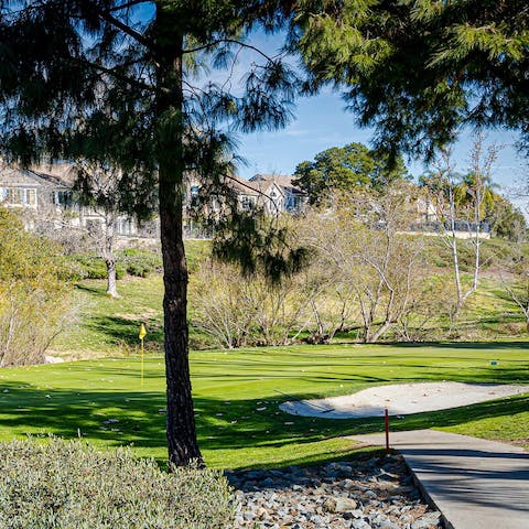 Play a round of golf at the private nine-hole course