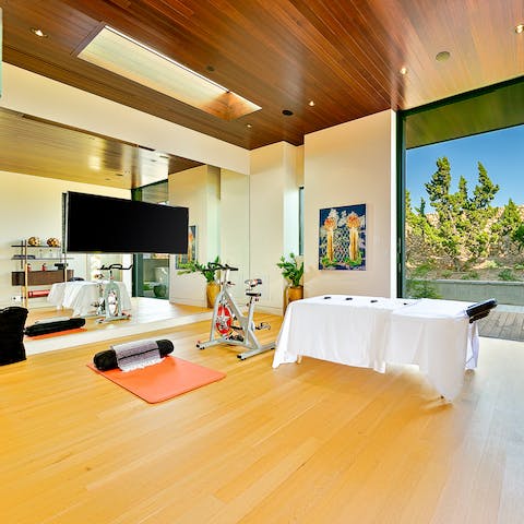 Let your host arrange a hot stone therapy massage or keep up your fitness treatment in the home gym