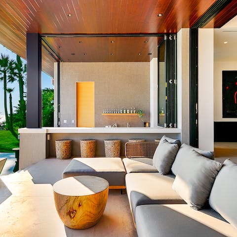 Mix up a minty cool mojito in the outside bar