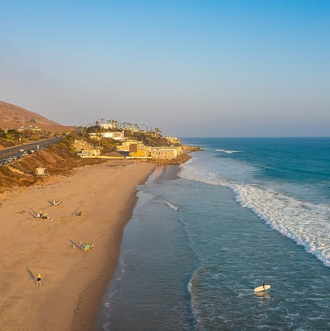 Go surfing at County Line Beach, a five-minute stroll away