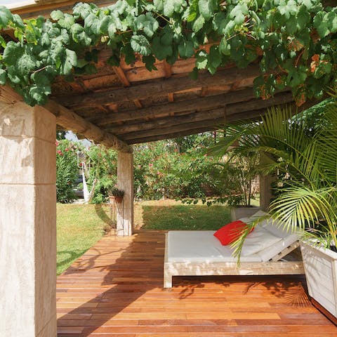Treat yourself to a well-deserved siesta under the pergola