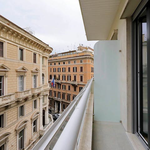 Sip a glass of Italian wine on the private balcony