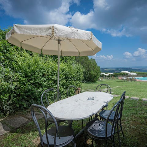 End the day with an alfresco dinner as the sun sets over the landscape
