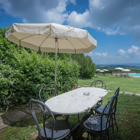 End the day with an alfresco dinner as the sun sets over the landscape