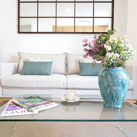 Sip sangria around this glass coffee table after an action-packed day of sightseeing
