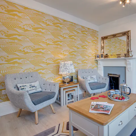 Kick back in the colourful maritime-themed living room with a glass of wine and a good book