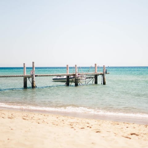 Spend a day on the sand at Calamosche Beach, a fifteen-minute drive away