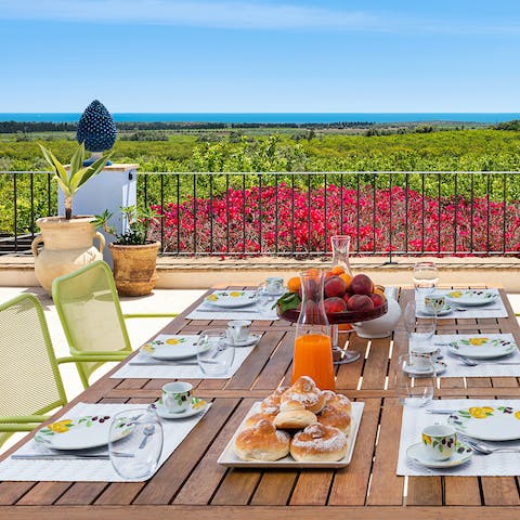 Enjoy breakfast with a sea view outside on the terrace