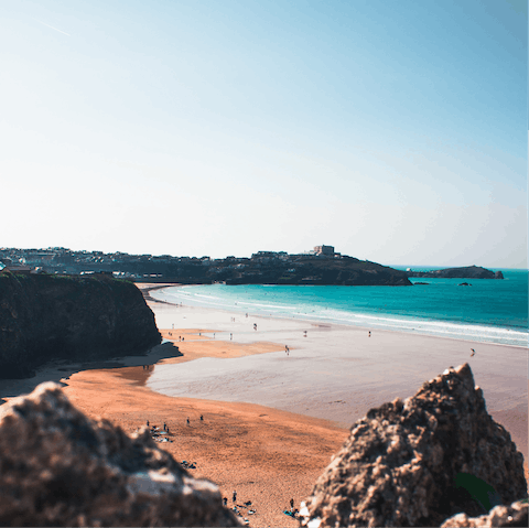 Head to the sandy shores of Tolcarne Beach for a seafront stroll