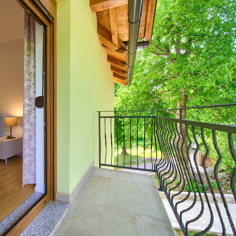 Bag a bedroom with a private balcony and look out over the trees