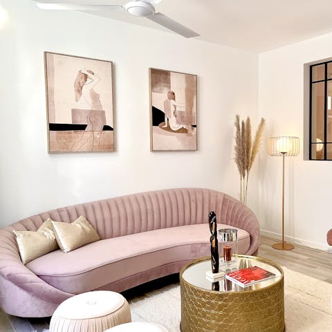 Uncork a bottle of Albariño and enjoy a fabulous night in on the chic pink sofa