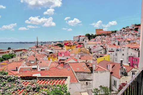 Explore Bairro Alto's labyrinthine streets packed with fado bars, a fifteen-minute walk