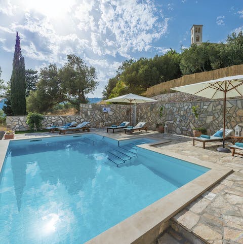 Cool off in the beautiful private swimming pool surrounded by trees