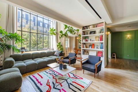 Gaze out across Parisian treetops from the lofty living space