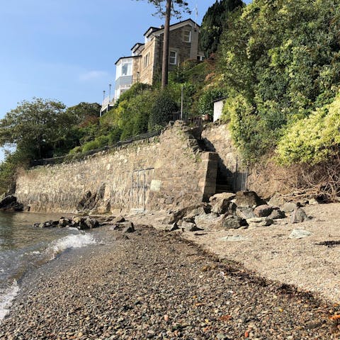 Step down to the home's private beach and go for a leisurely dip in the Menai Strait