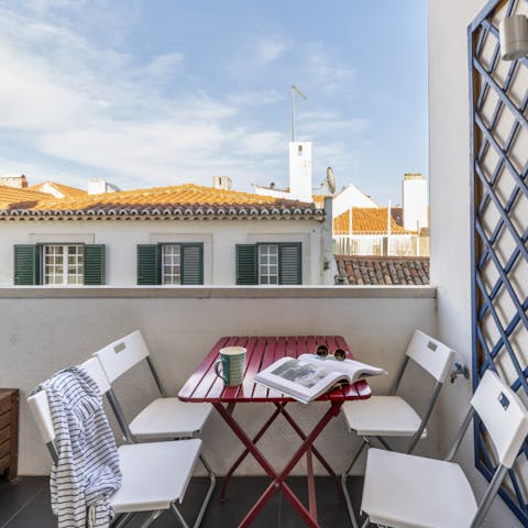 Breakfast on the terrace, overlooking the old town rooftops